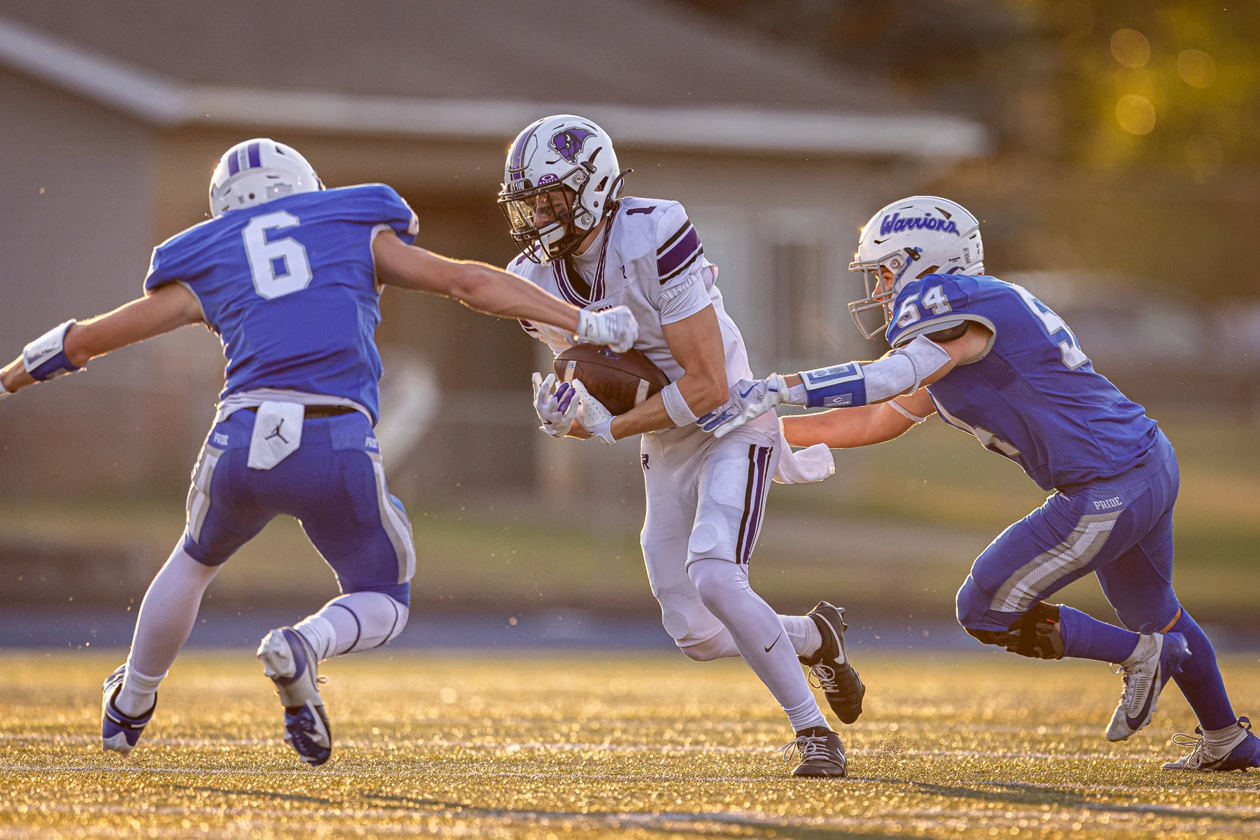 WR with the ball getting down the field with defenders around him